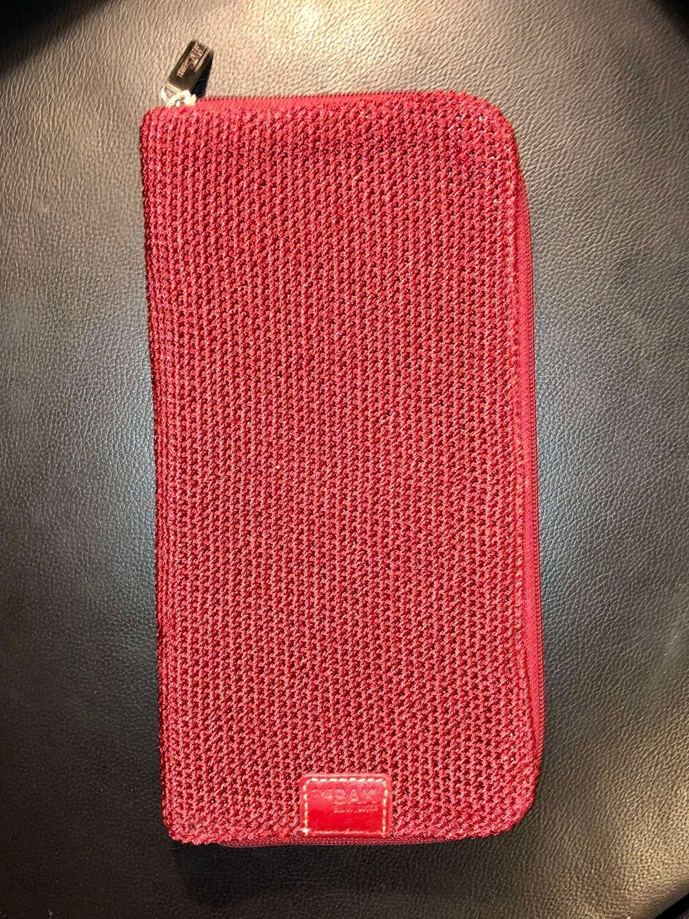 The Sak red tight-knit crochet zip-around wallet